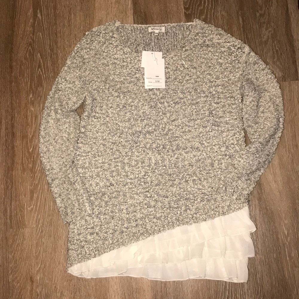 neutral toned tunic with ruffles